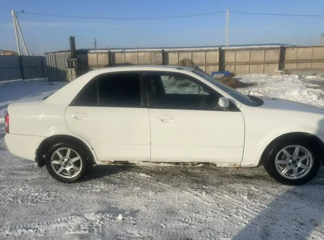 Легковой автомобиль, марка: Mazda, модель: Familia, год изготовления: 1999, цвет: белый, мощность двигателя, л. с. (кВт): 110