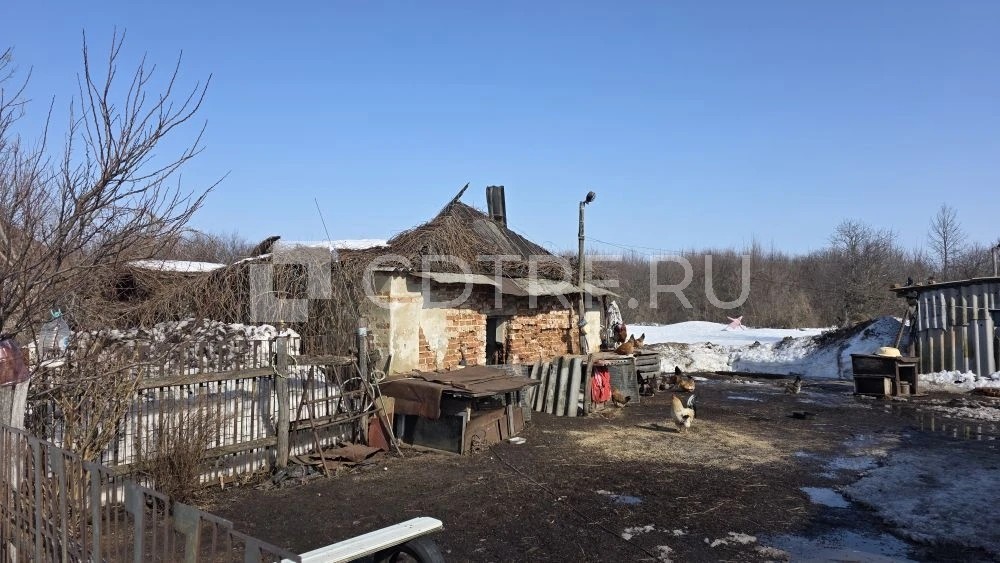 Земельный участок с находящимся на нём домом