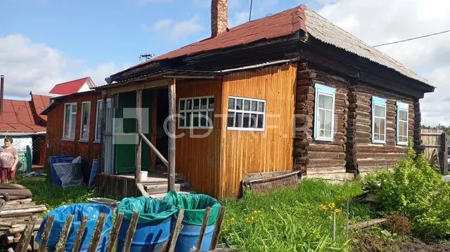 Жилой здание на земельном участке в Томской обл.