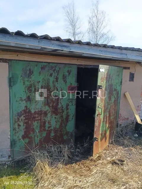 Земельный участок, площадь 22 кв.м., и расположенный на нем гаражный бокс, площадь 21.8 кв