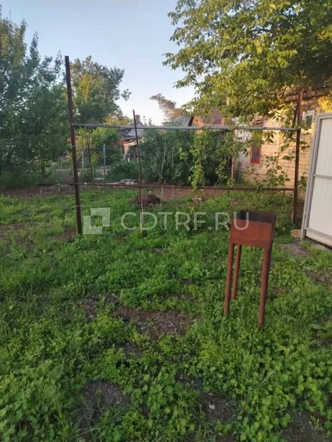 Жилой дом и земельный участок в Ростовской обл., Октябрьский р-н, сл. Красюковская