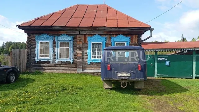 Жилой здание на земельном участке в Томской обл.