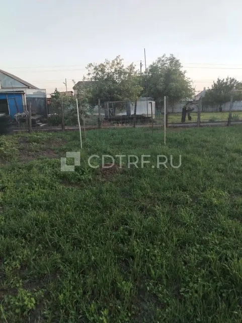 Жилой дом и земельный участок в Ростовской обл., Октябрьский р-н, сл. Красюковская