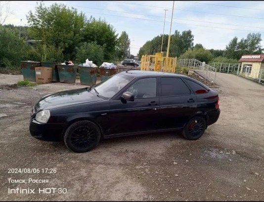 Легковой автомобиль LADA 217220 LADA PRIORA, 2012 года выпуска, VIN XTA217220C0219194, государственный регистрационный знак Е118НХ70, цвет сине-черный, тип кузова – легковой комби (хэтчбек), 5 дверей, двигатель 21116 № 3026556, мощность 87 л.с. (64 кВт), паспорт транспортного средства 63 НР 534835, свидетельство о регистрации 99 48 099202