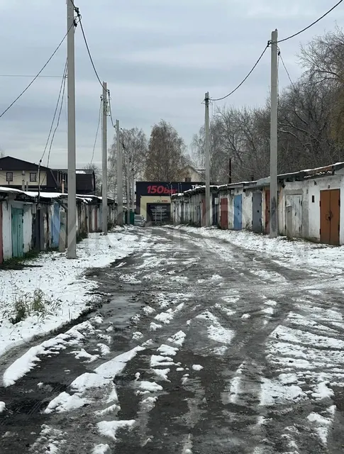 Гараж 18,3 кв.м. и земельный участок 21,8 кв.м. в Кемеровской обл.
