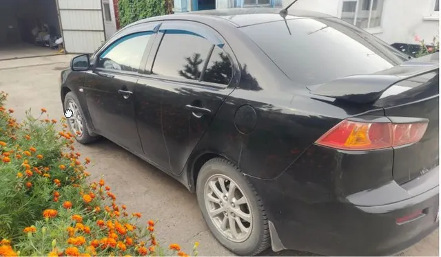 Автомобиль Марка MITSUBISHI Модель Lancer VIN JMBSRCY2A8U004903 Регистрационный номер А156АТ122 Тип ТС легковой универсал Год выпуска 2007 Цвет черный СТС 99 16 491176