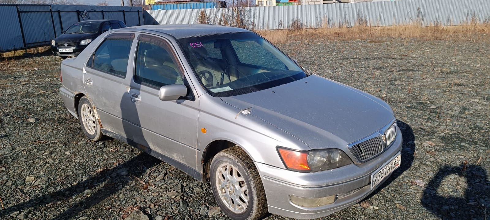 Автомобиль марки “Toyota Vista” государственный номер К 751 НТ 65.