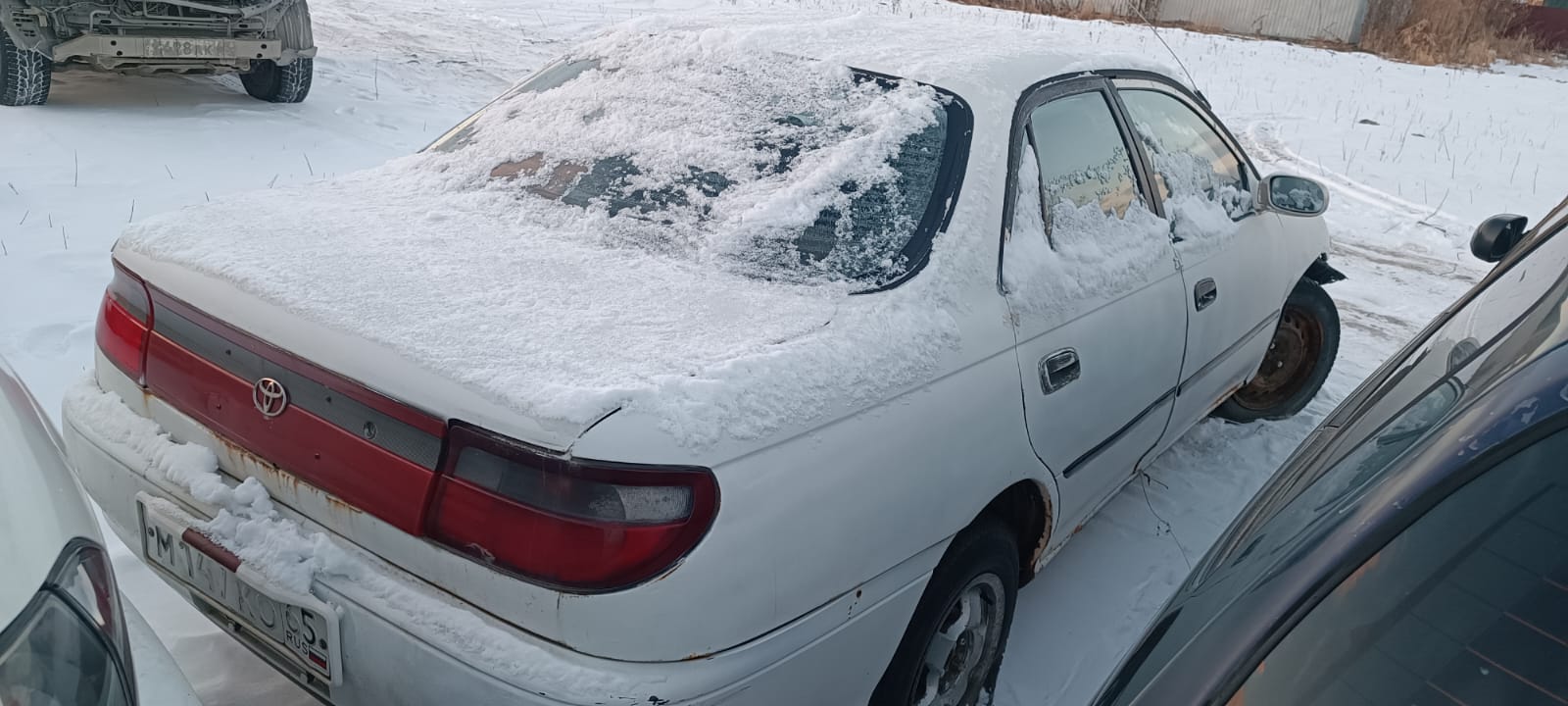 Автомобиль марки “Toyota Carina ” государственный номер М 147 КО 65