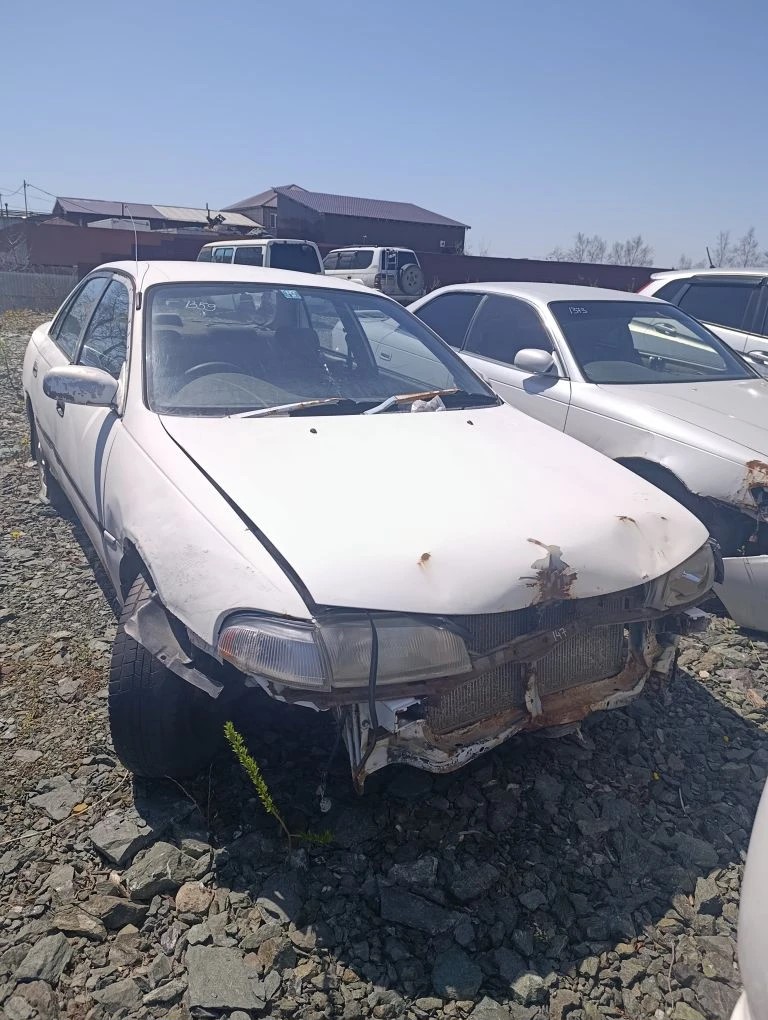 Автомобиль марки “Toyota Carina ” государственный номер М 147 КО 65