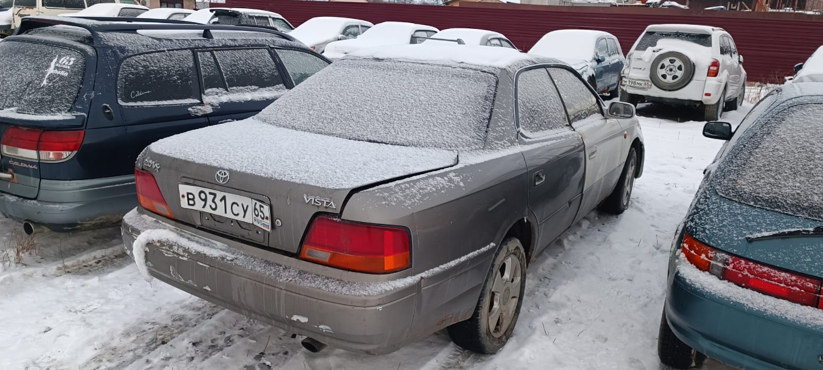 Автомобиль марки “Toyota Vista”, государственный номер В 931 СУ 65