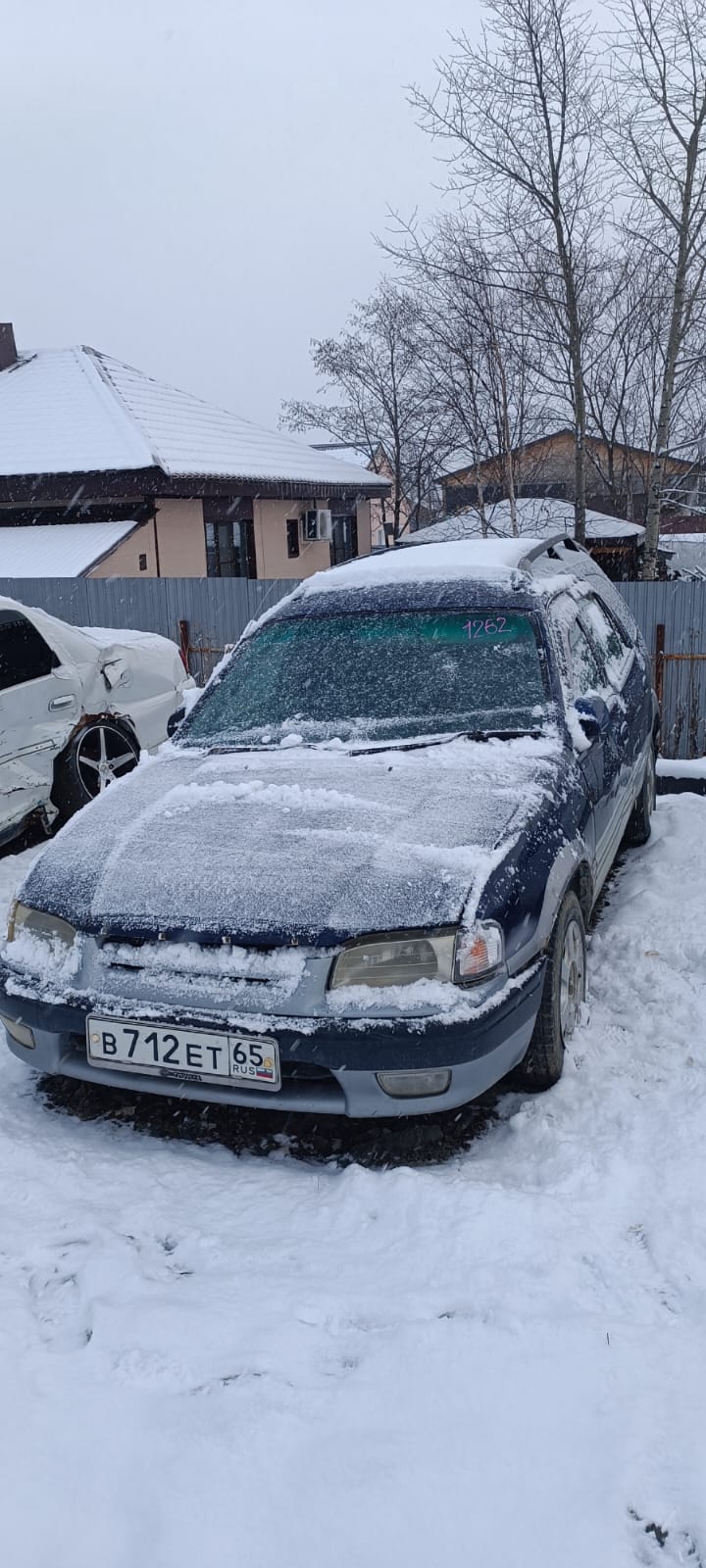 Автомобиль марки “Toyota Sprinter Carib” государственный номер В 712 ЕТ 65