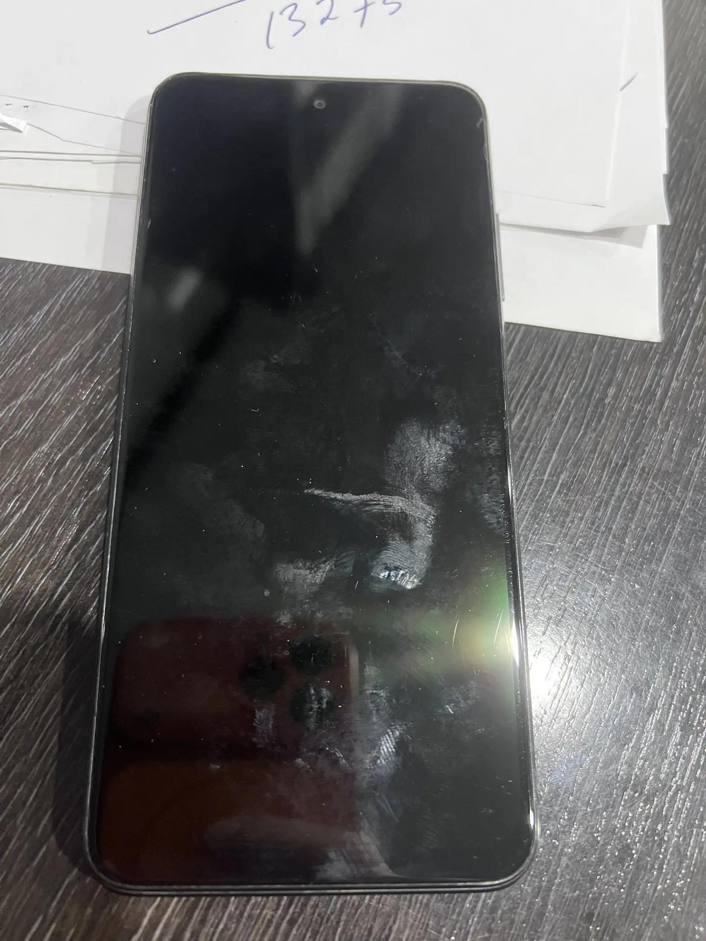 мобильный телефон Redmi в корпусе черного цвета с сим-картой сотового оператора Мегафон 1 Штука (шт)