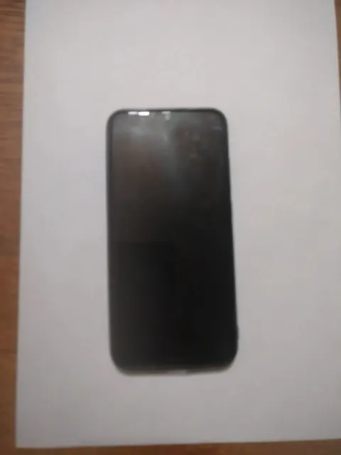 Сотовый телефон марки Redmi в корпусе черного цвета — 1 шт.
