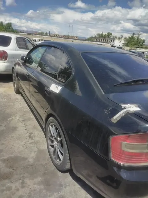 Транспортное средство марки «Subaru Legacy», 2005 года выпуска, номер кузова «BL5-039204», регистрационный номерной знак 01 KG678ADQ . (годные остатки) (задержанное)