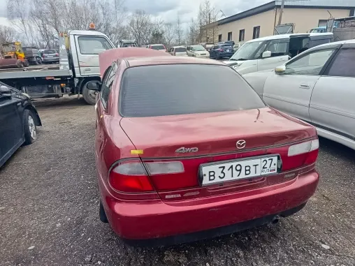 Автомобиль марки   MAZDA FAMILIA  г/н В319ВТ27,1986 г.в., № кузова BHA6R302328.красного цвета, имеются повреждения переднего бампера, вмятина на капоте.