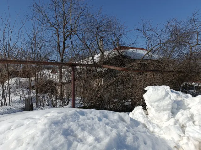 Жилой дом с прилегающим земельным участком