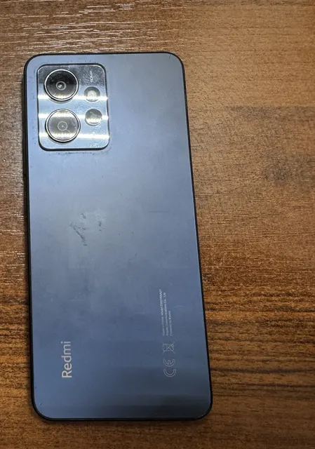 Сотовый телефон марки «Xiaomi Redmi Note 12», б/у, черного цвета