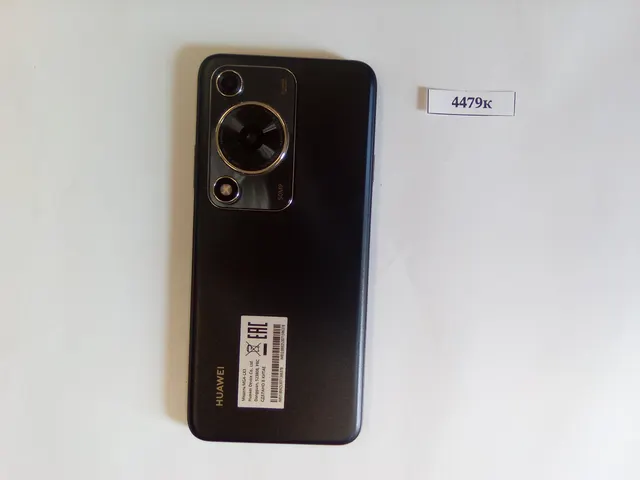 Сотовый телефон марки "Huawei MGA-LX3", в чехле черного цвета с установленной сим картой сотового оператора МТС