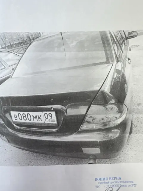 Легковой автомобиль МИТСУБИСИ ЛАНСЕР, 2006 года выпуска, цвет синий, государственный номер В080МК09, идентификационный номер VIN: JMBSNCS3A7U006503, КЧР, г. Черкесск, ул. Куйбышева, д. 26.
